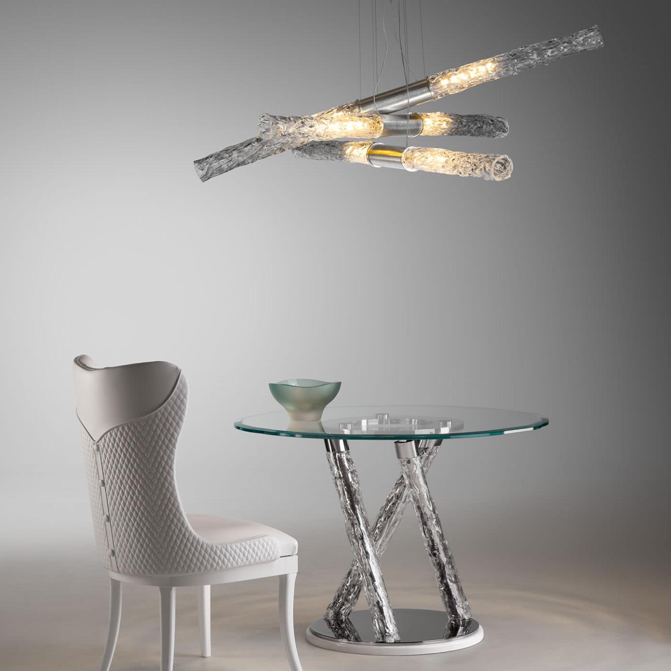 Ronde glazen eettafel met sculpturale poten