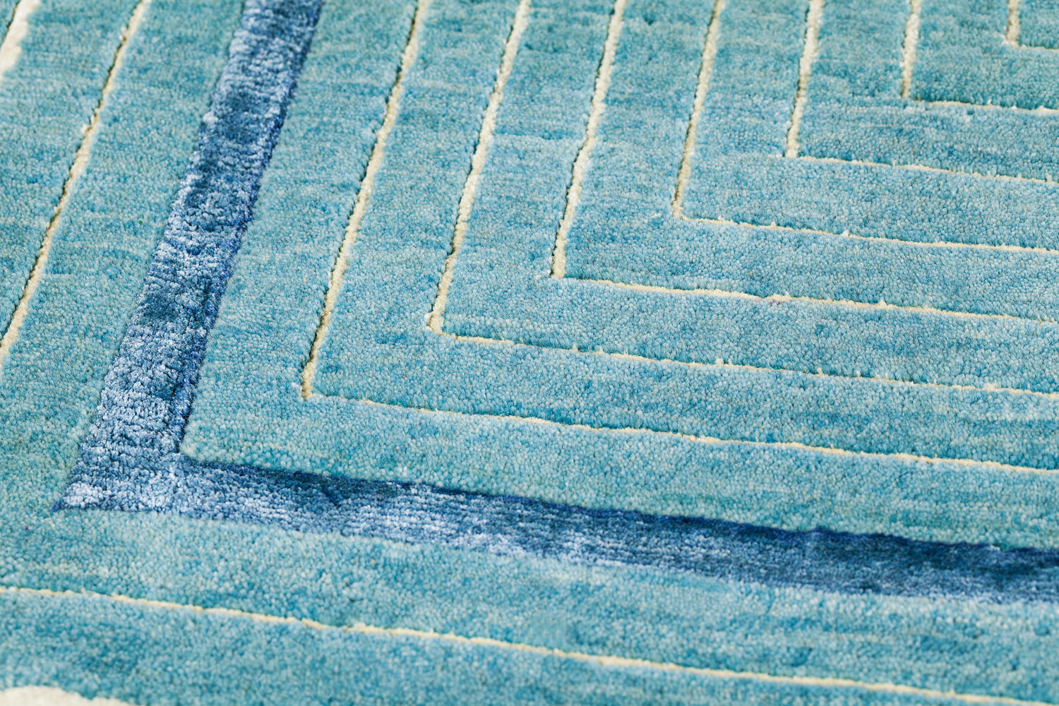 Handgeknoopt turquoise kader wol & viscose vloerkleed