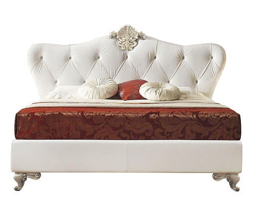 Bed met wit lederen hoofdeinde